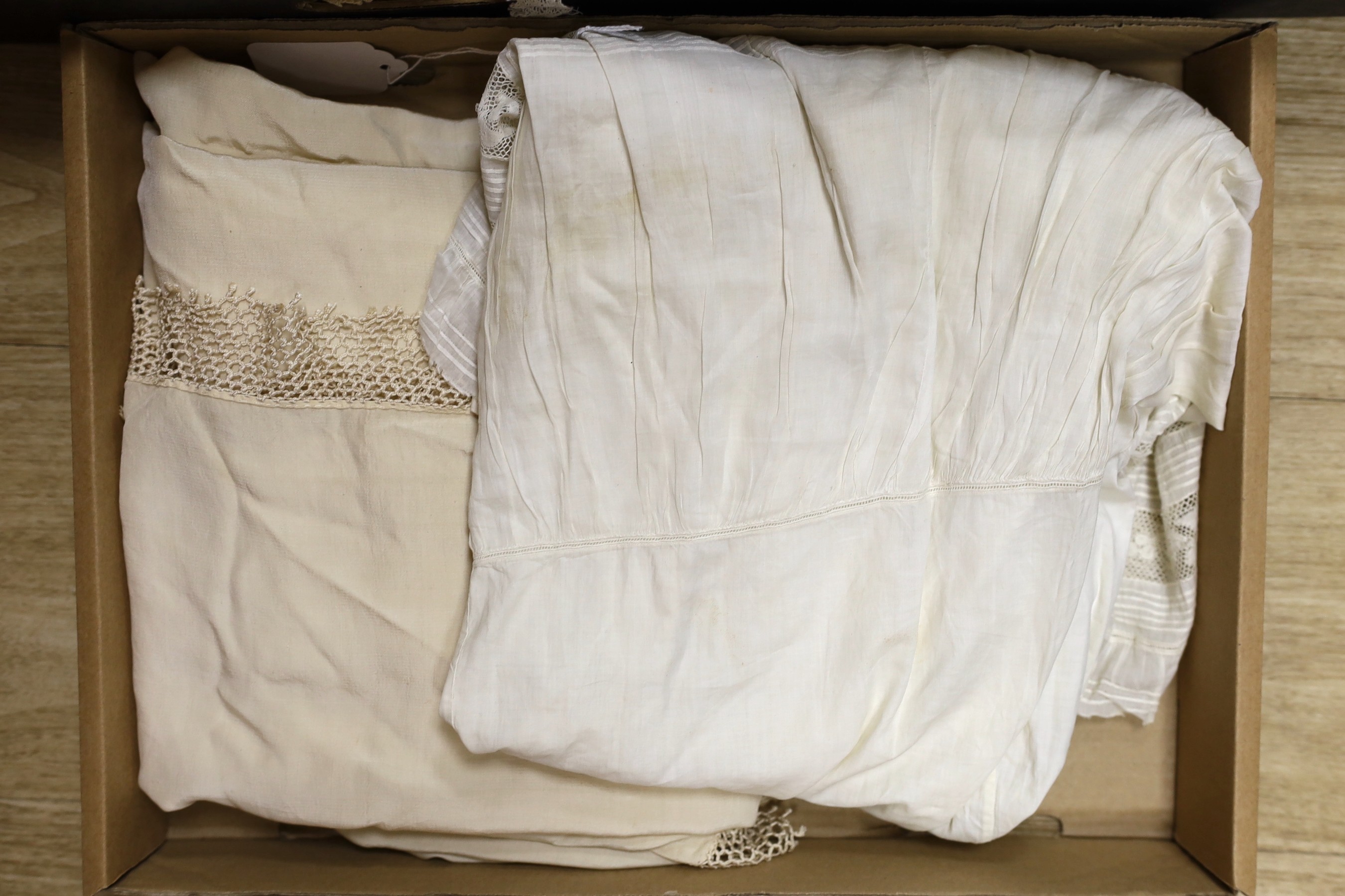 A quantity of mixed machine and some handmade lace including Irish crochet, together with a white work petticoat, silk christening gown and a silk shawl